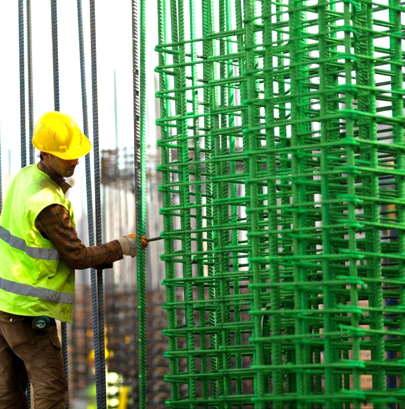 Epoxy coated TMT reinforcement bars on a construction site